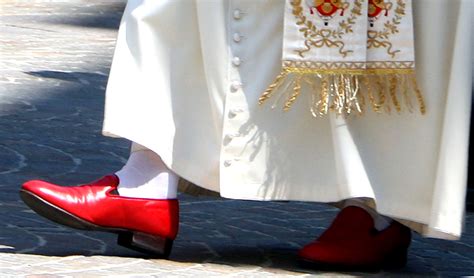 why does pope wear red shoes